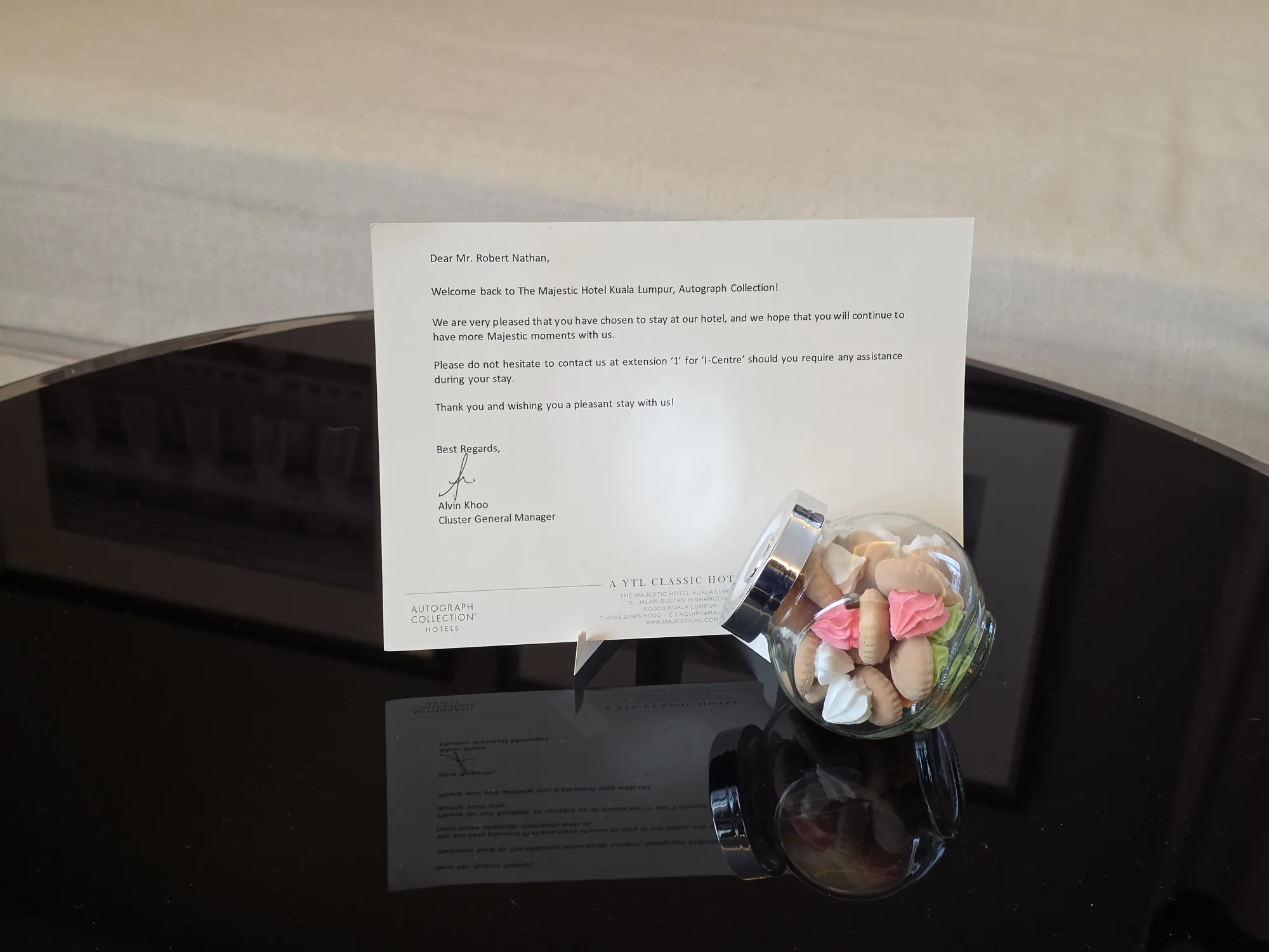 A welcome note and a jar of treats in our room at The Majestic Hotel