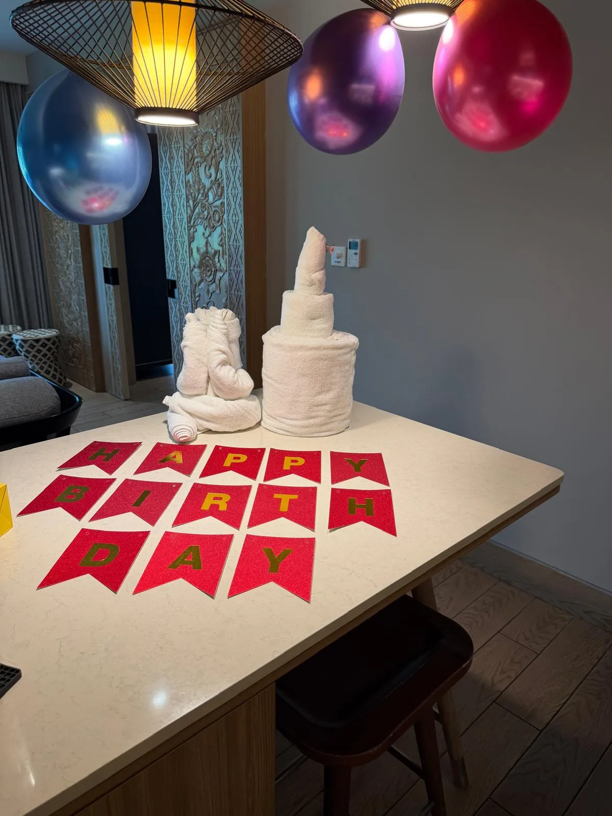 Balloons and birthday decorations on the villa table