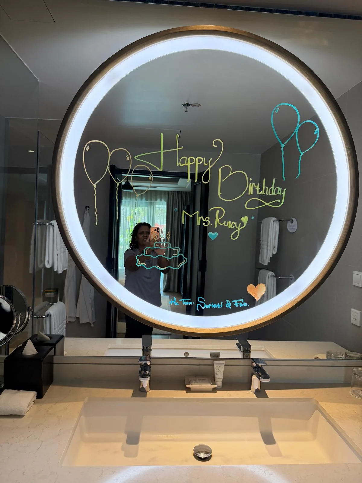 Birthday wishes written on the bathroom mirror