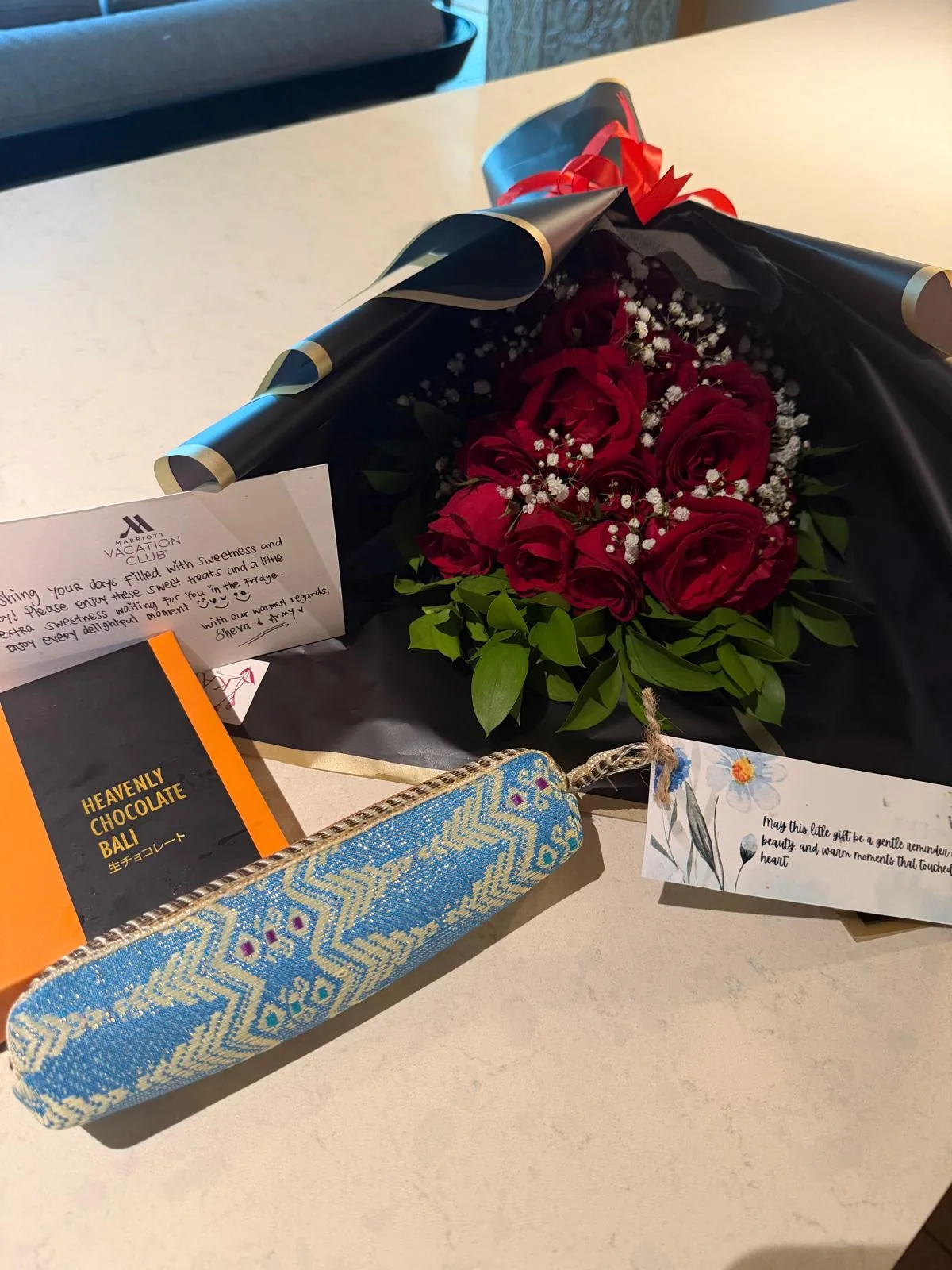 Flowers, gifts, and handwritten notes arranged in the villa