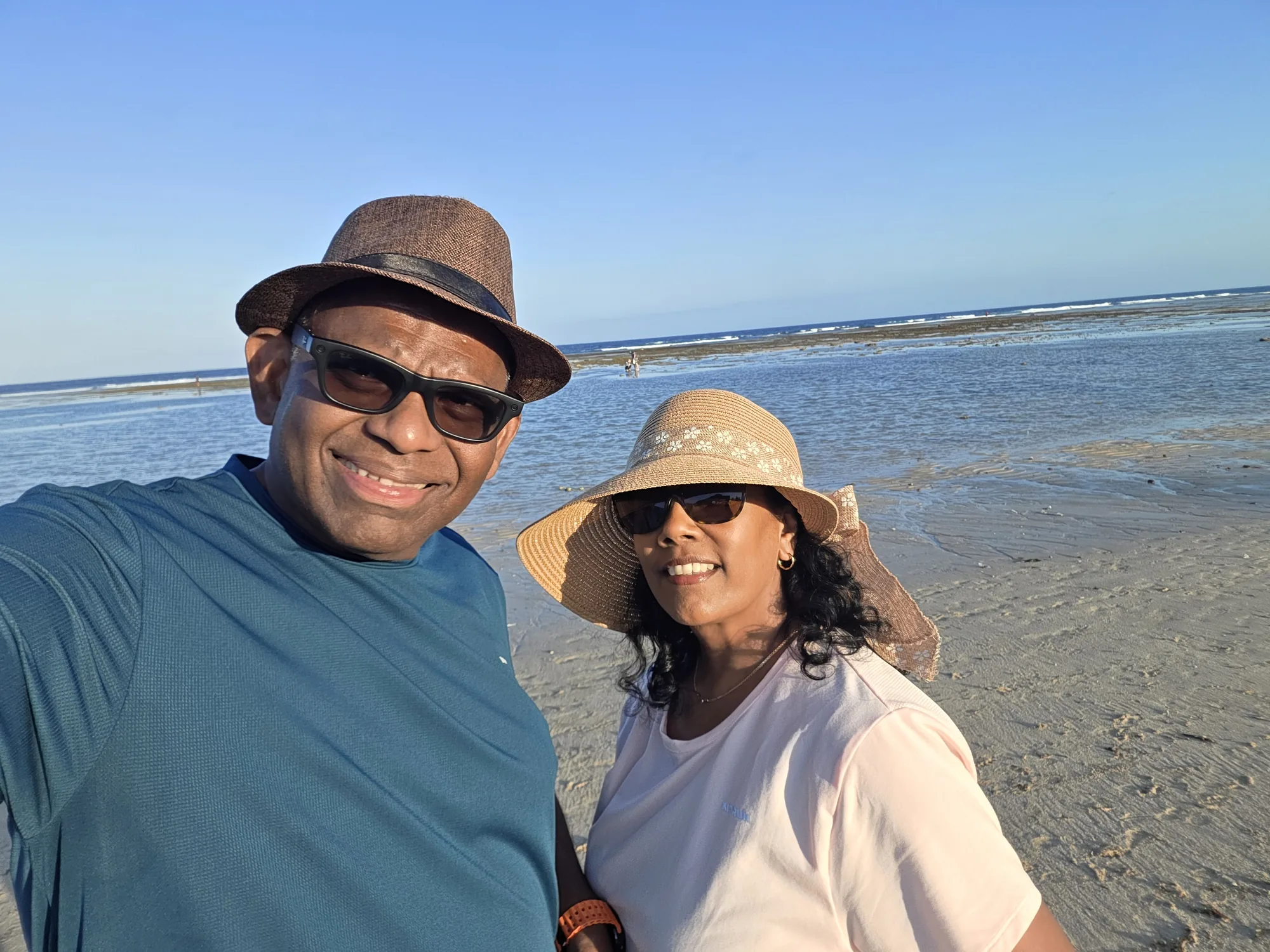 Robert and Ruky smiling together beside the sea in Bali
