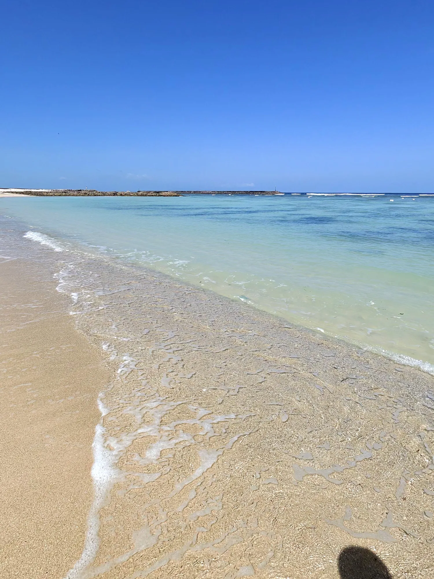 White sand and clear turquoise water at The Ritz-Carlton beach