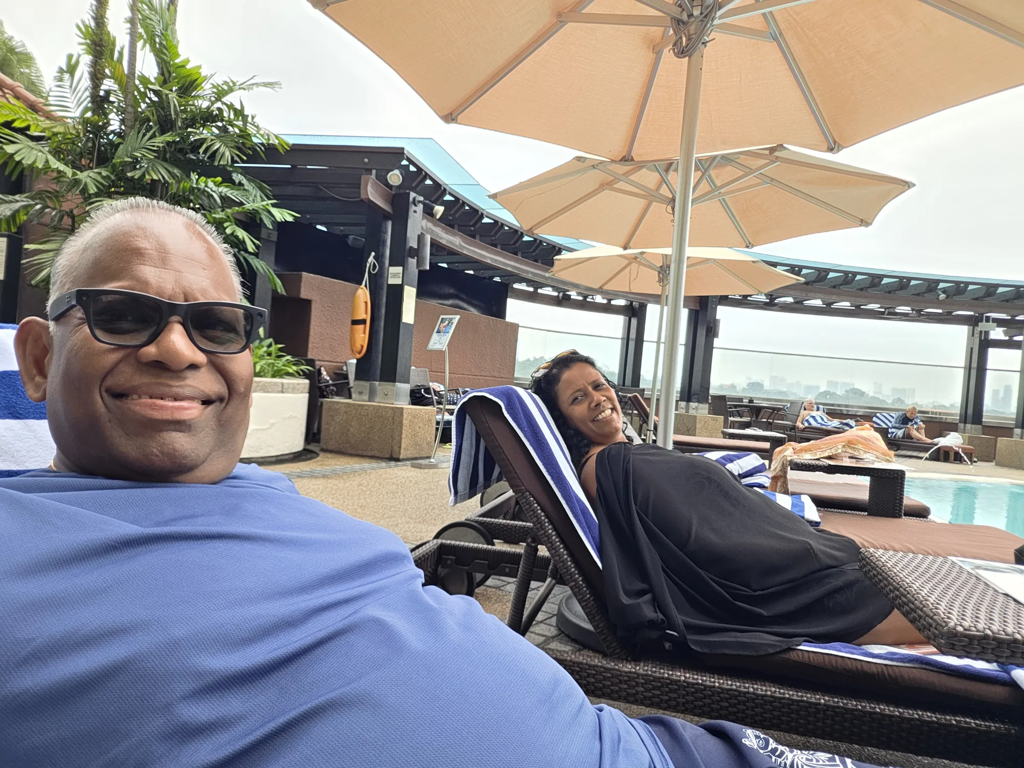 Relaxing on loungers beside the Hilton Kuala Lumpur pool